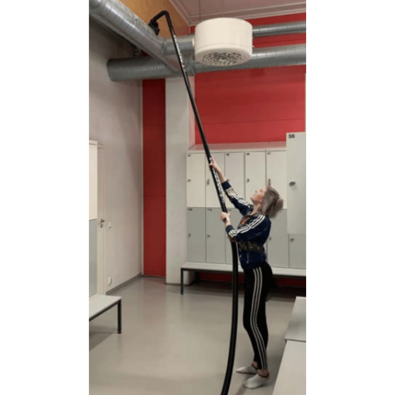 SpaceVac Interior Lite Vacuum Cleaner Kit SV38/LITE - person cleaning on top of duct in internal warehouse setting with spacevac kit.