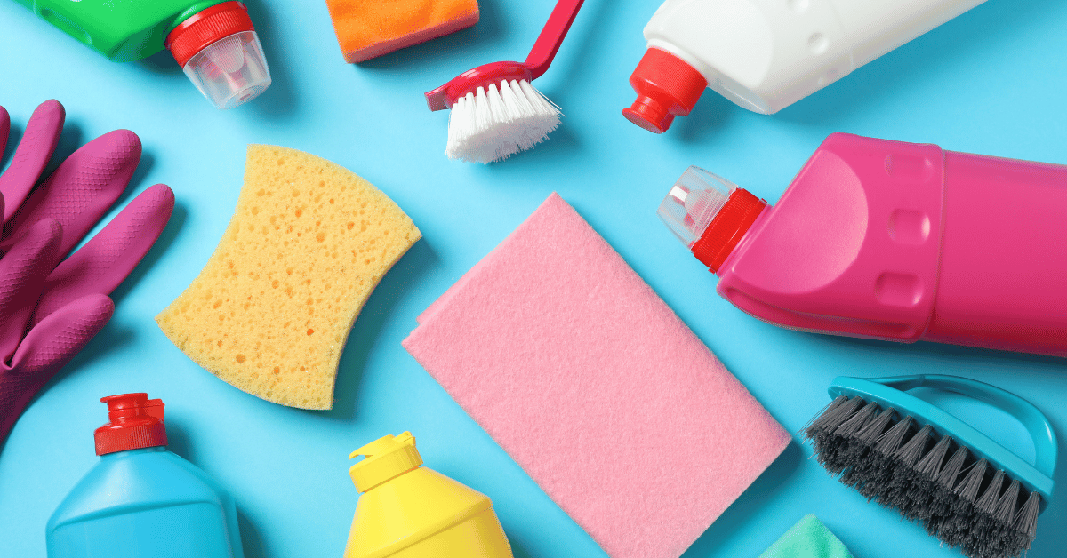 The Ultimate Commercial Cleaning Equipment Checklist for New Businesses - multiple small cleaning tools on a blue coloured bench 