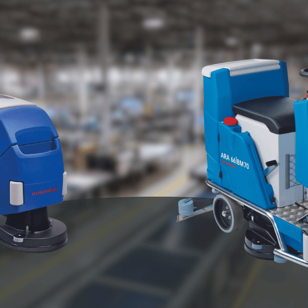 A Columbus walk behind and ride on floor scrubber side by side on a industrial background