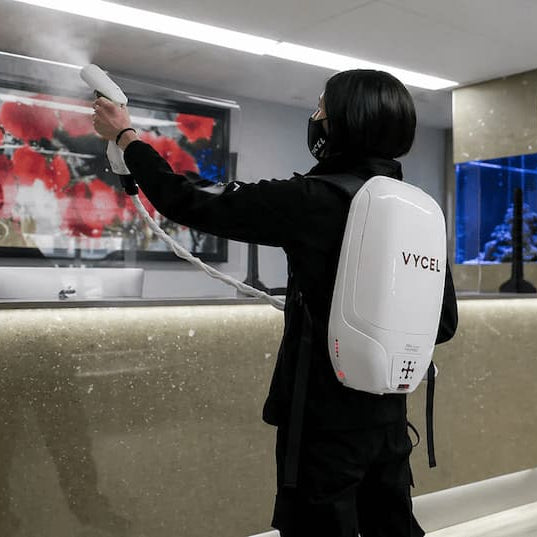 woman cleaning the glass