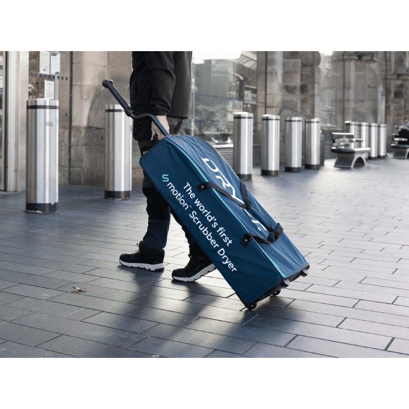 Cleanstar Dryft Transport Bag being carried across a tiled floor by a man. 