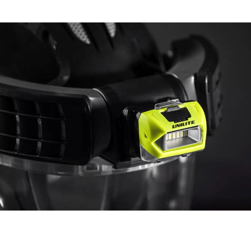 JSP Powercap Infinity HEPA Full Face Respirator black in colour close up view with yellow coloured head torch attached