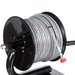 Black reel with coiled hose on a white background