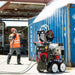 Jetwave Senator G2FI 350-23 Cold Water Petrol Pressure Cleaner Trolley with industrial pressure cleaning in progress.