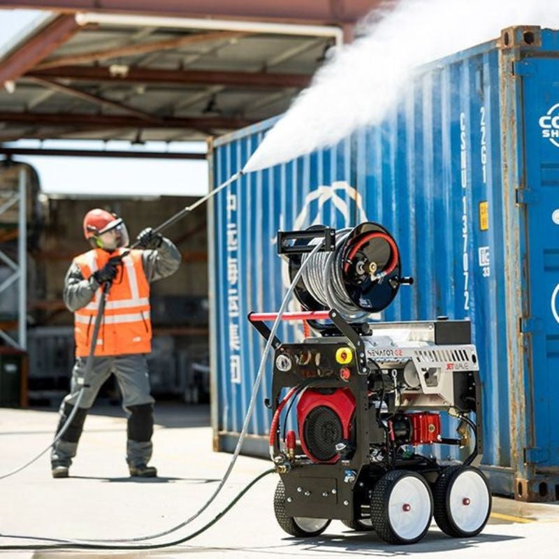 Jetwave Senator G2FI 350-26 Cold Water Petrol Pressure Cleaner while worker is using the machine safely.