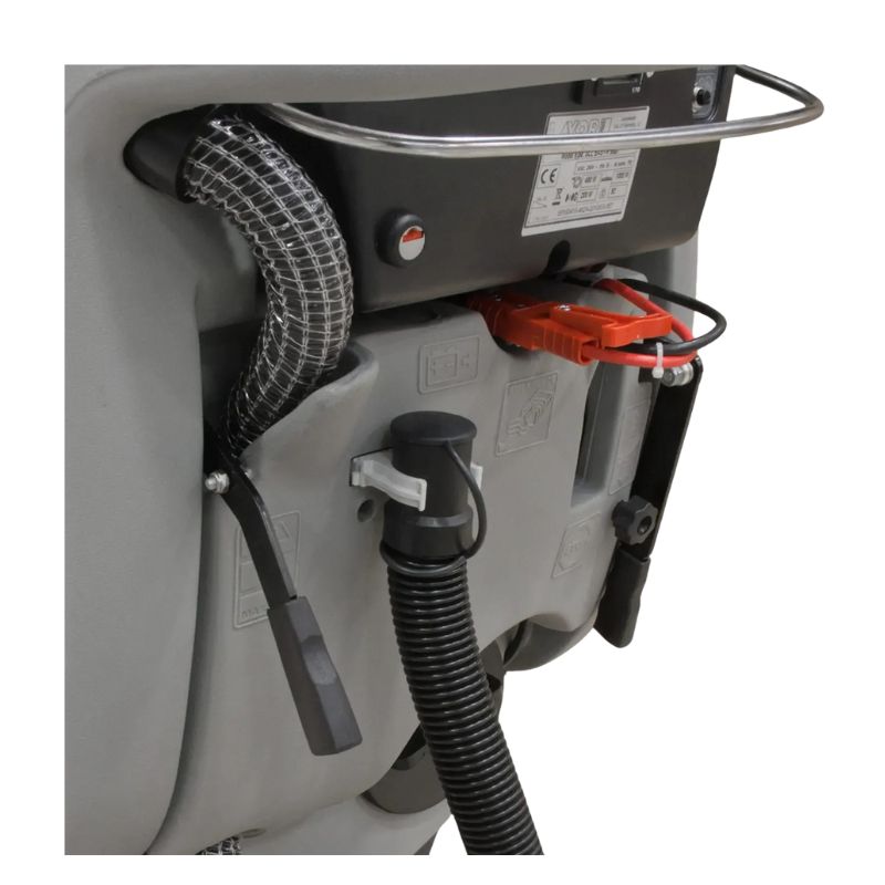 Rear compartment of Lavorwash floor scrubber showing the hose and battery area