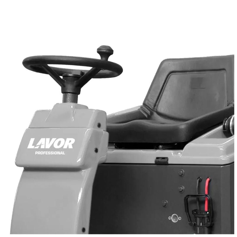 Operator steering column and seat area of Lavorwash SWL1000ET ride-on floor sweeper.