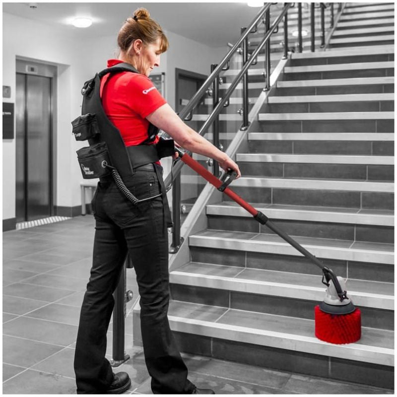 Motorscrubber Medium Length Floor Scrubber woman using the motorscrubber.