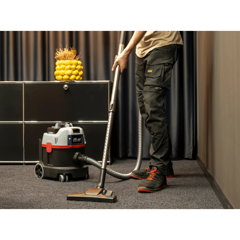 SPRiNTUS ERA iGO Cordless Canister Vacuum Cleaner being used on carpet floor in room 