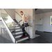 SPRiNTUS ERA iGO Cordless Canister Vacuum Cleaner being used up and down stairs inside house