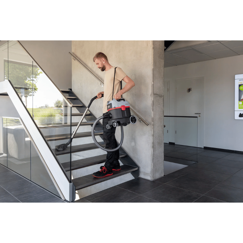 SPRiNTUS ERA iGO Cordless Canister Vacuum Cleaner being used up and down stairs inside house
