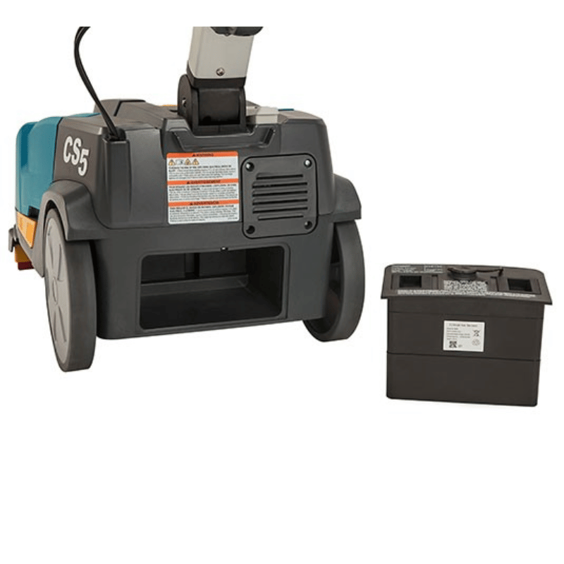Tennant CS5 Micro Floor Scrubber with battery pack on the ground on a blank white background