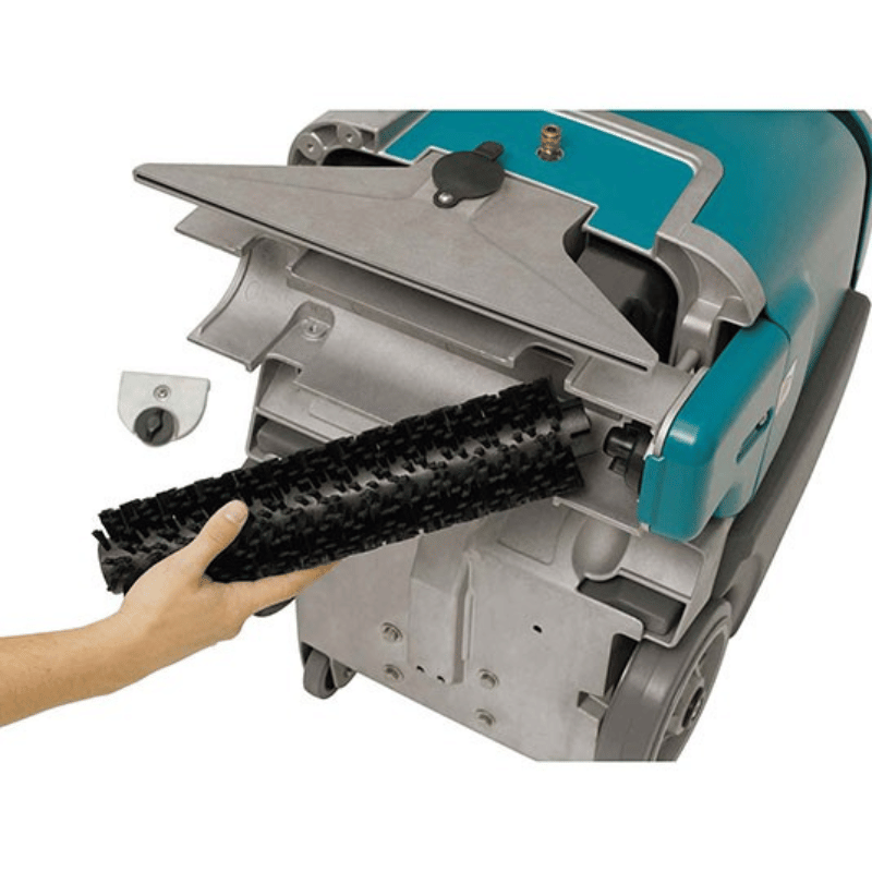 Tennant E5 Compact Walk Behind Carpet Extractor scrubbing brush being replaced by a person on a white background