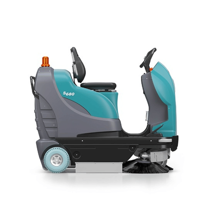 Tennant S680 Compact Ride On Floor Sweeper side profile view on a white background