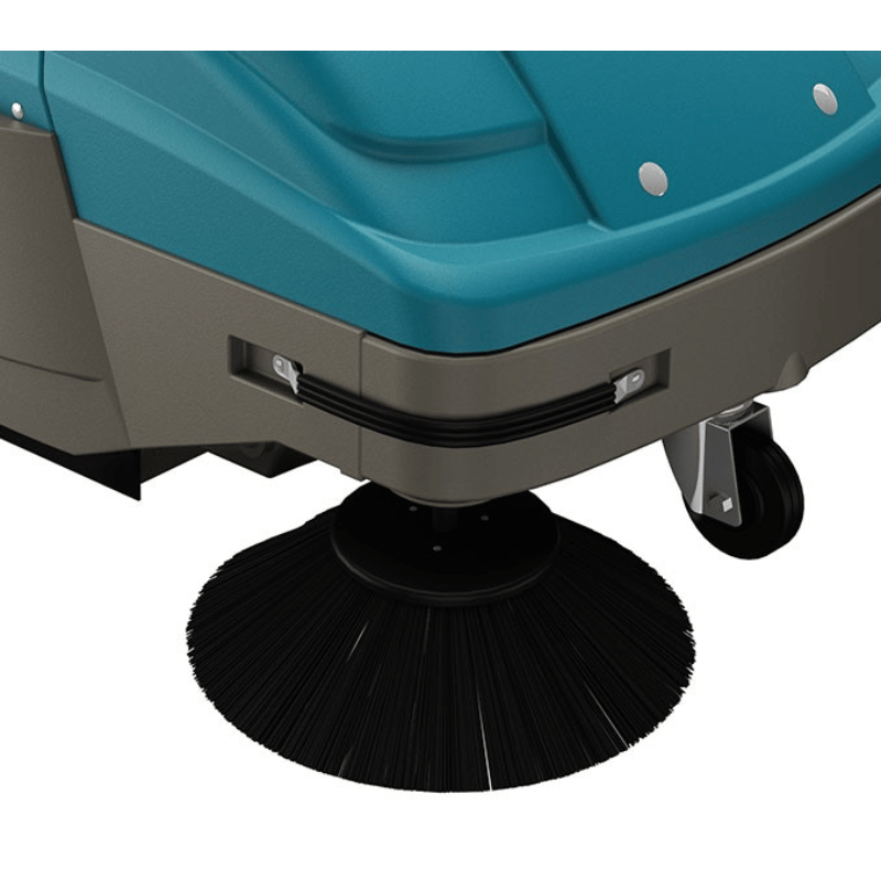 Close-up of a Tennant S7 Walk behind floor sweeper with a brush on a white background