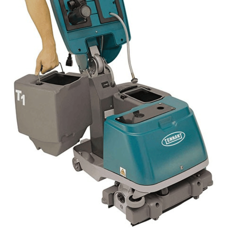Tennant T1 Corded Compact Floor Scrubber with a person's hand holding a bucket, branded 'Tennant'.