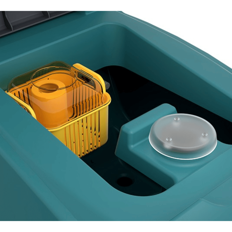 Teal Tennant T360 Floor scrubber with yellow basket and white bowl inside