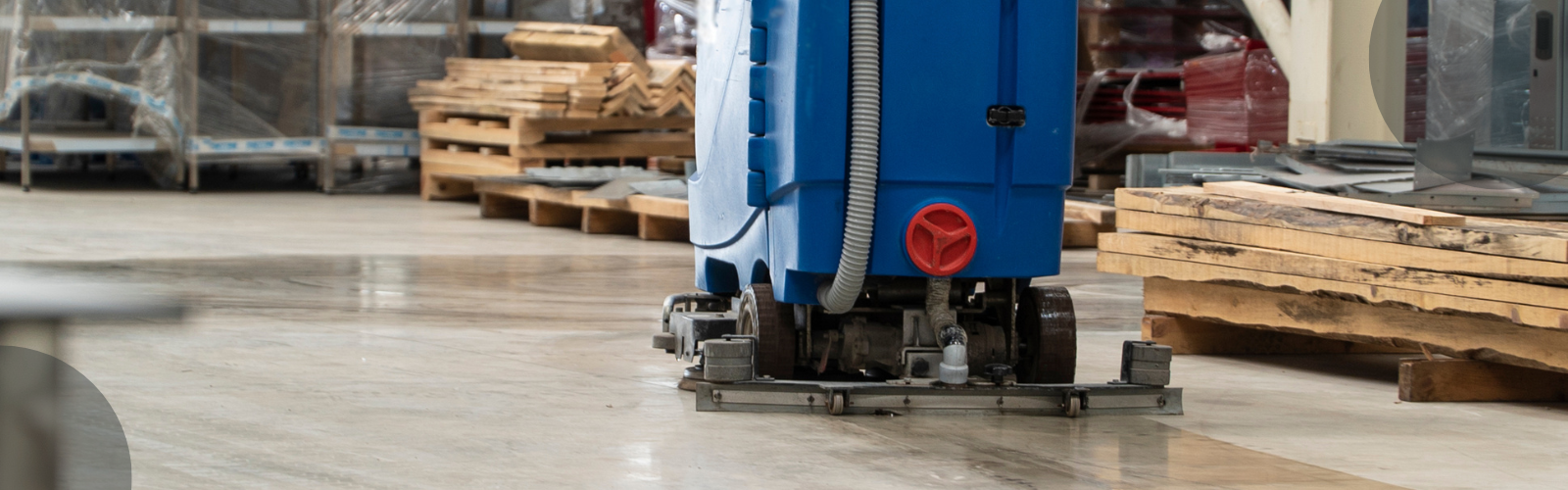 floor scrubber cleaning a warehouse floor scrubber is blue in colour