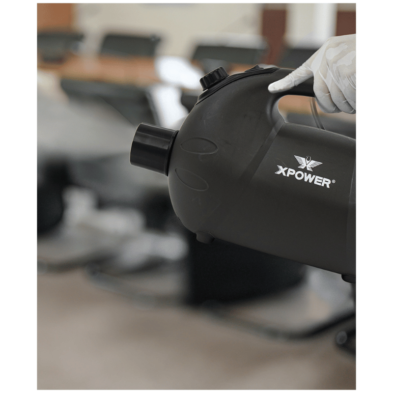 XPOWER Battery Powered Cordless ULV Cold Fogger F16B lifestyle image of person holding the fogger