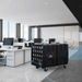 Xpower AP2000 High Volume Commercial Air Scrubber in a modern office setting with desks and large windows.