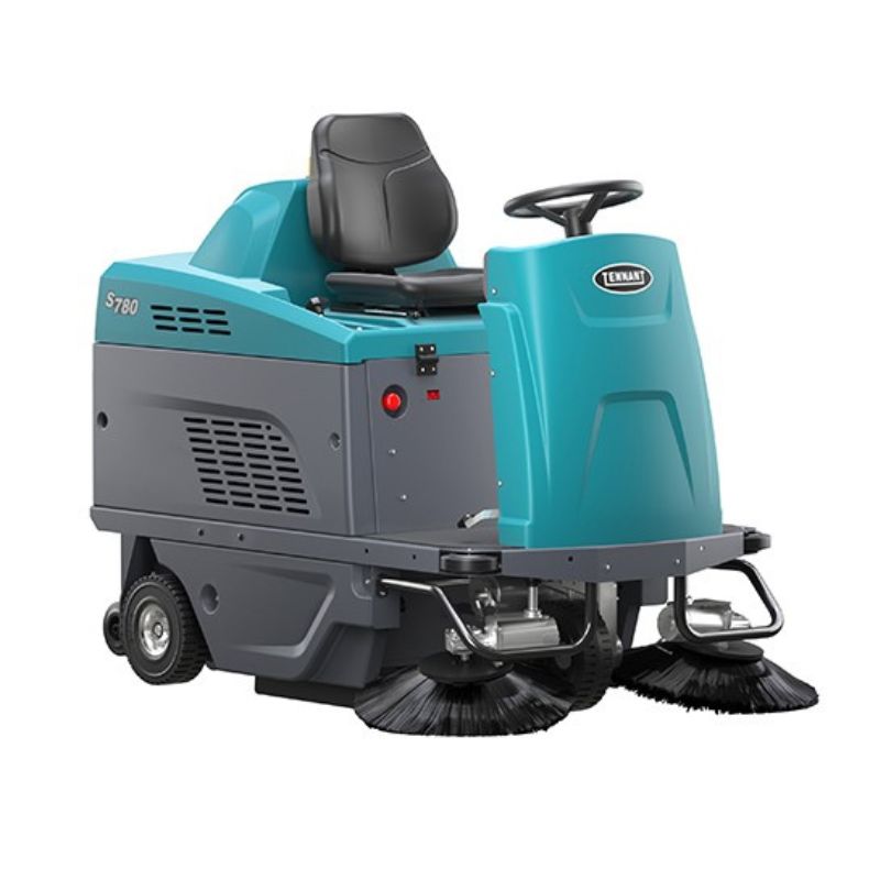 Tennant S780 Compact Ride-On Floor Sweeper on white coloured background
